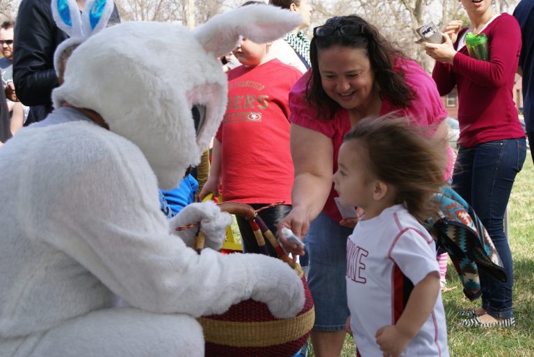 ECCO's Easter Bunny offers a prize to a girl with windblown hair