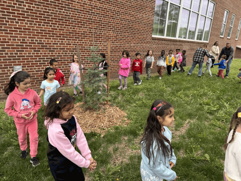 Hartley Elementary School Kindergartners and the tree they helped plant